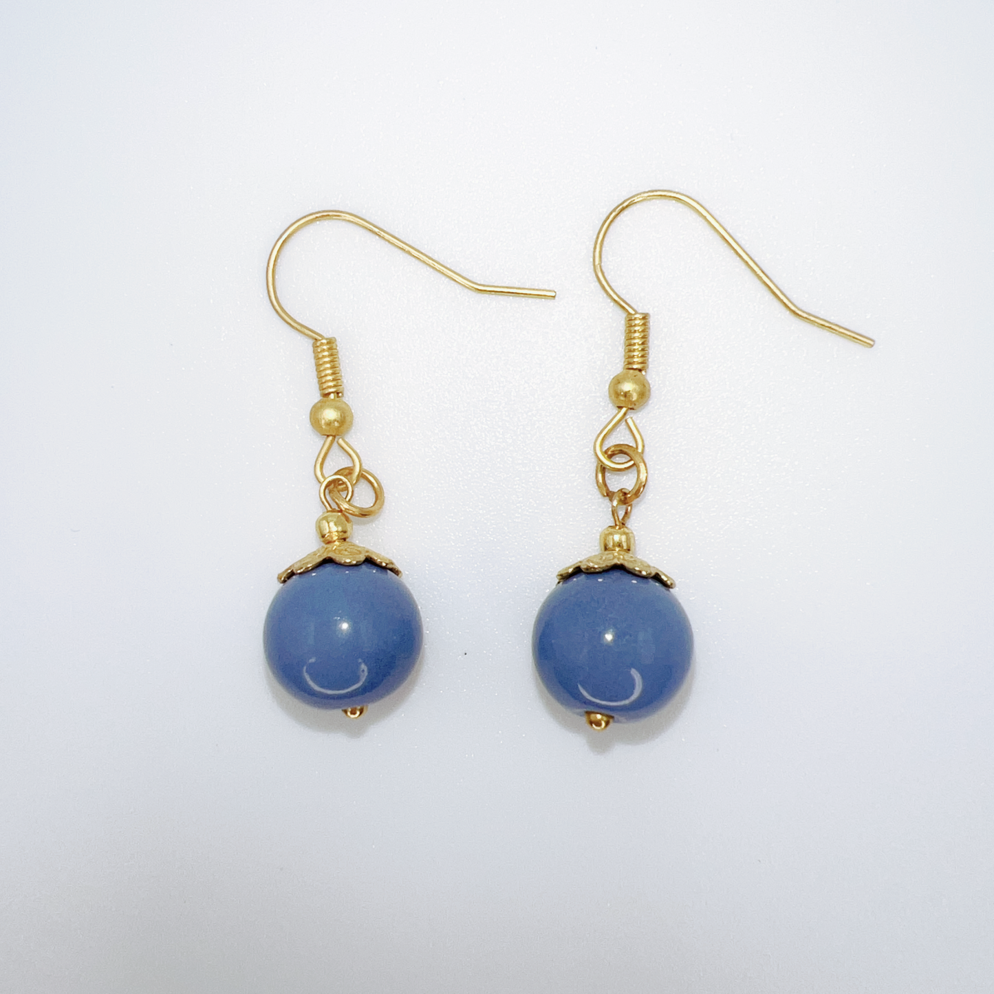 Elegant Gold-Tone Earrings with Blue Dangle